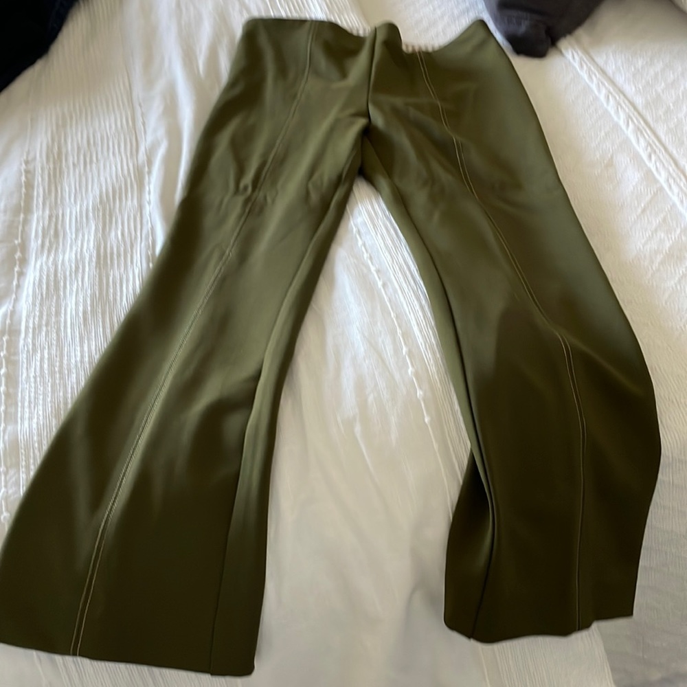 Olive green, crop flare XSP. Stitching front and back seams